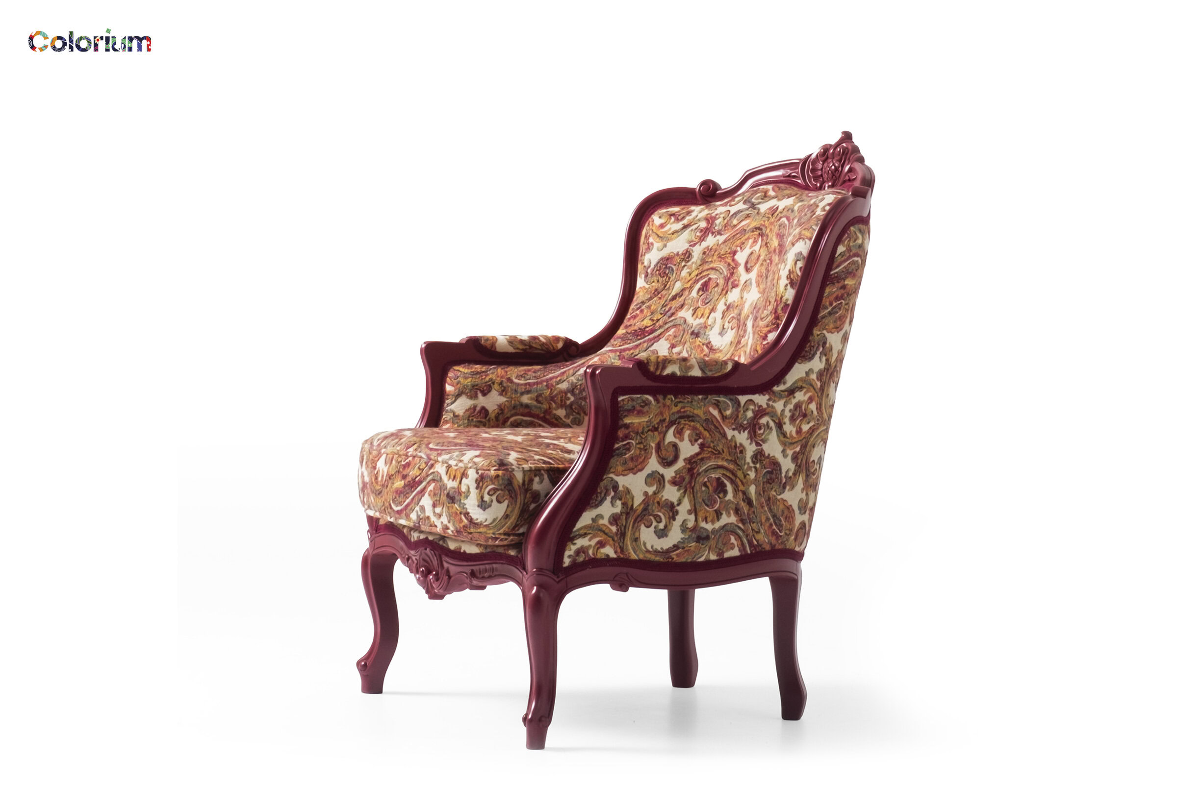 Luxurious vintage armchair with carved wooden frame and ornate fabric upholstery, perfect for elegant living rooms and sophisticated interior design.