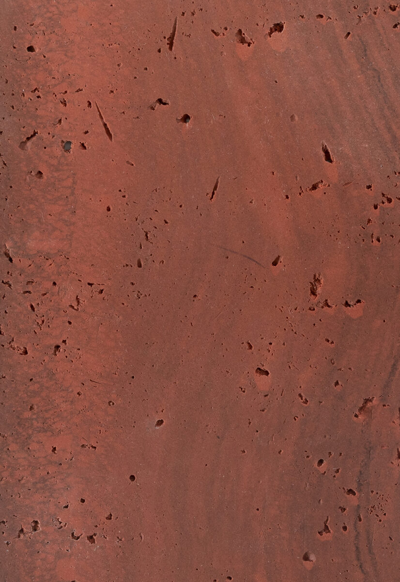 Rich red distressed wall texture showcasing a rustic and industrial design suitable for modern home or furniture branding. Perfect for highlighting furniture such as tables, chairs, and decor items.