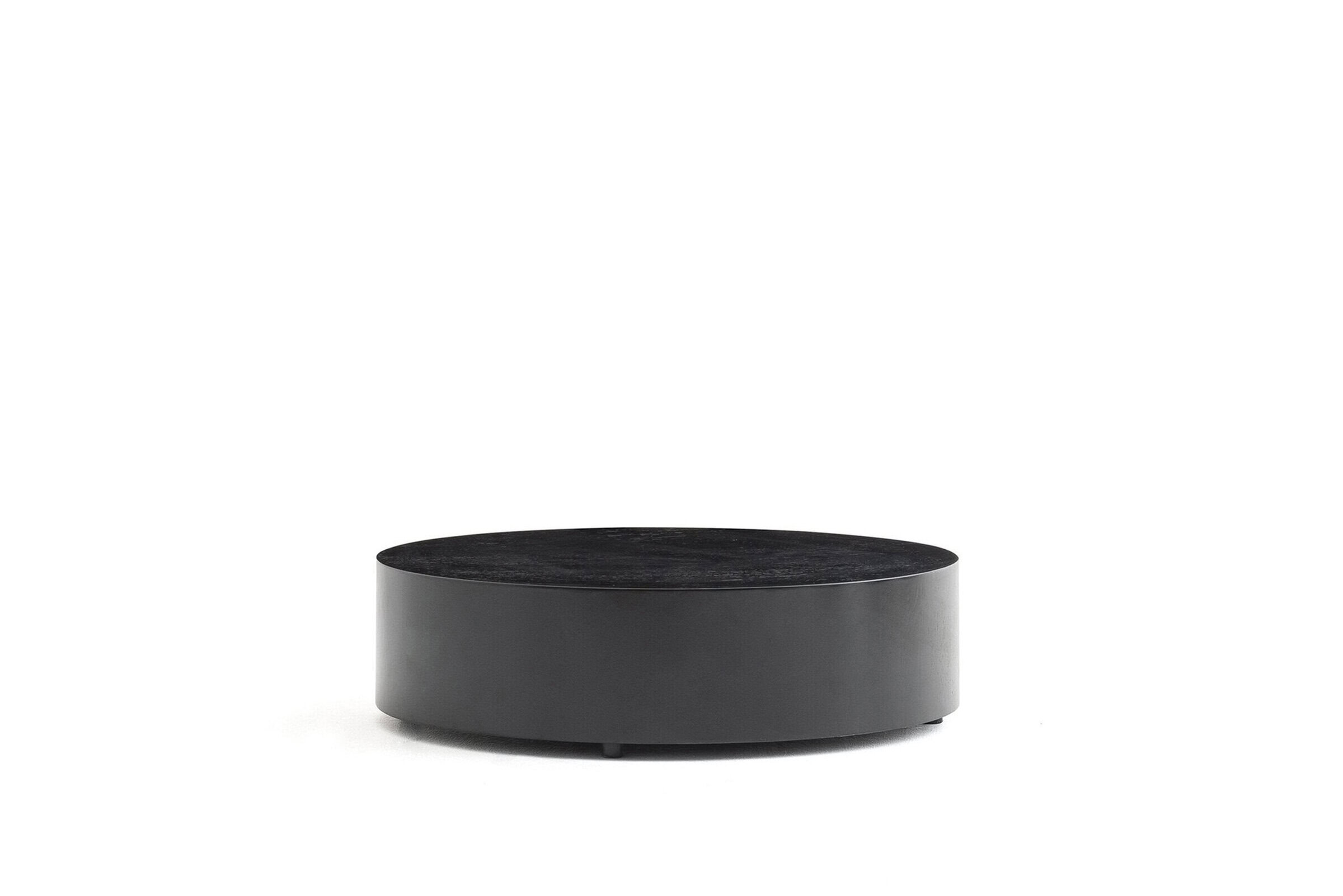Minimalist black round coffee table with sleek design, perfect for modern living rooms and contemporary decor. Crafted for style and functionality, enhancing your home ambiance.