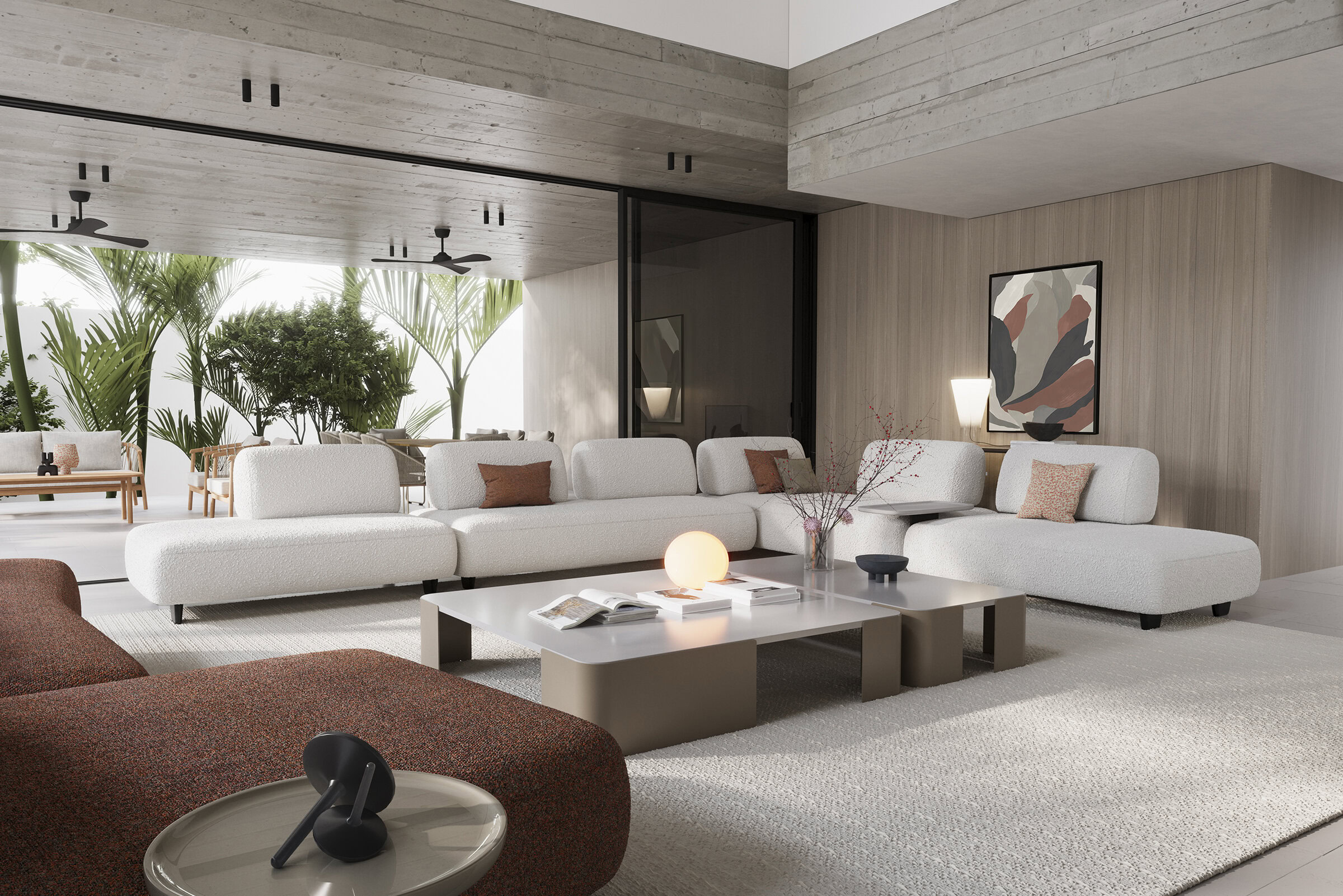 Elegant living room featuring white sectional sofas, contemporary decor, and abundant natural light from large windows, creating a stylish and comfortable space.