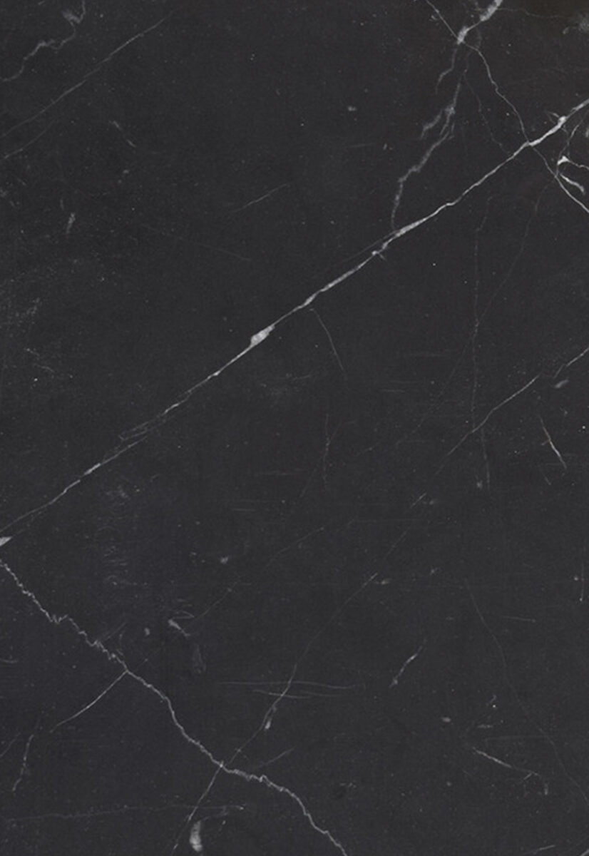 Black marble surface with white veining, ideal for high-end furniture and interior decor. Perfect for countertops, tabletops, and statement pieces in modern and classic interiors.