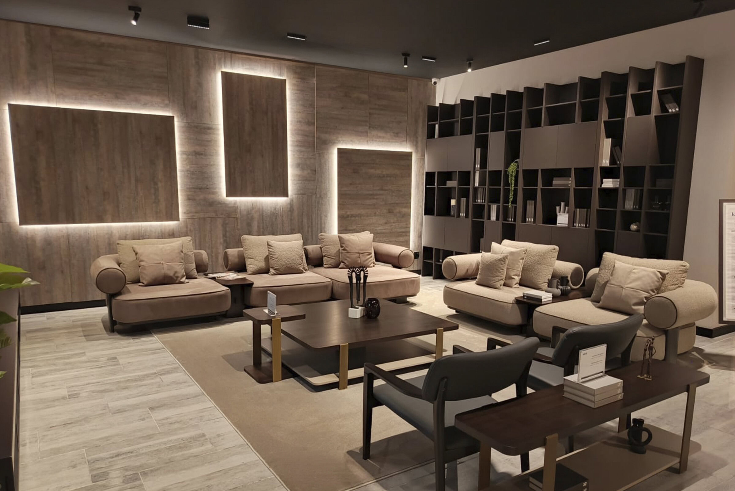 Elegant modern lounge sofa set featuring plush beige cushions and sleek wooden accents, perfect for stylish living rooms and reception areas.
